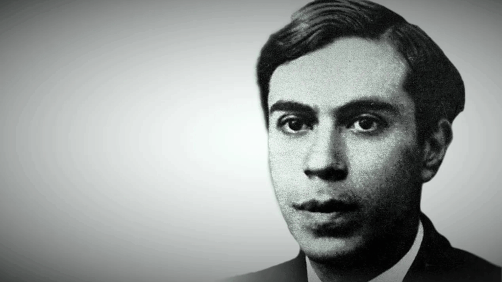 foto bianco e nero di ettore majorana di tre quarti sulla destra, fondo grigio